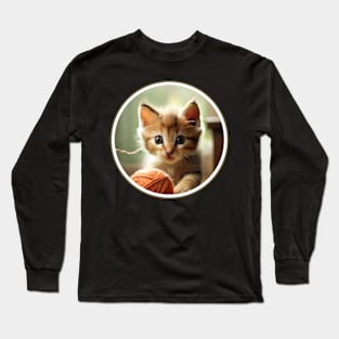 A playful kitten chasing a ball of yarn. Long Sleeve T-Shirt